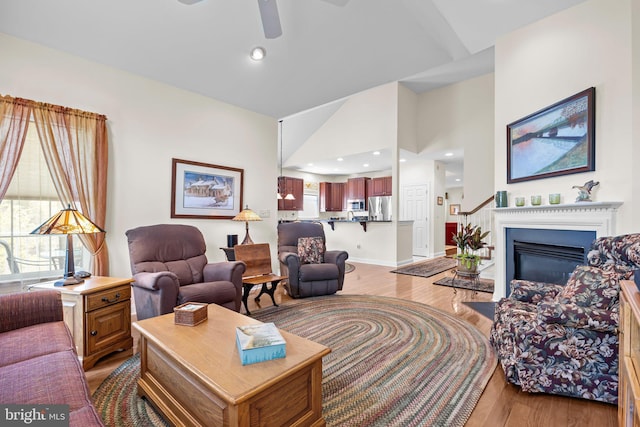 230 Bobwhite Rd, New Hope, PA 18938 - living area featuring light wood-style flooring, ceiling fan, a glass covered fireplace, recessed lighting, and lofted ceiling