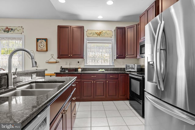 230 Bobwhite Rd, New Hope, PA 18938 - kitchen with appliances with stainless steel finishes, a sink, recessed lighting, dark brown cabinets, and light tile patterned floors