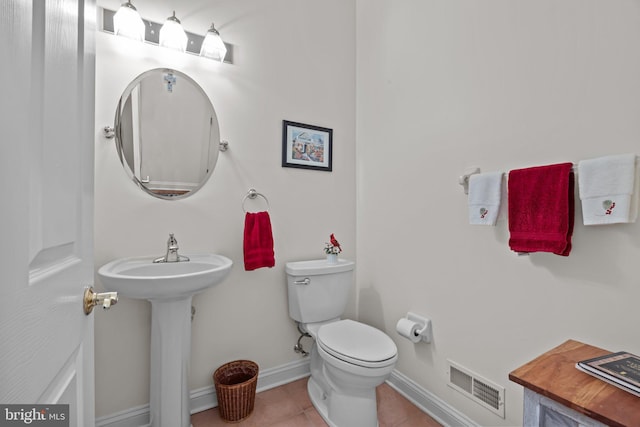 230 Bobwhite Rd, New Hope, PA 18938 - half bathroom with toilet, tile patterned flooring, baseboards, and a sink