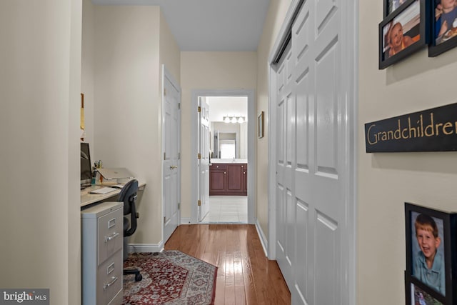 230 Bobwhite Rd, New Hope, PA 18938 - hallway with dark wood-style flooring, an office area, and baseboards