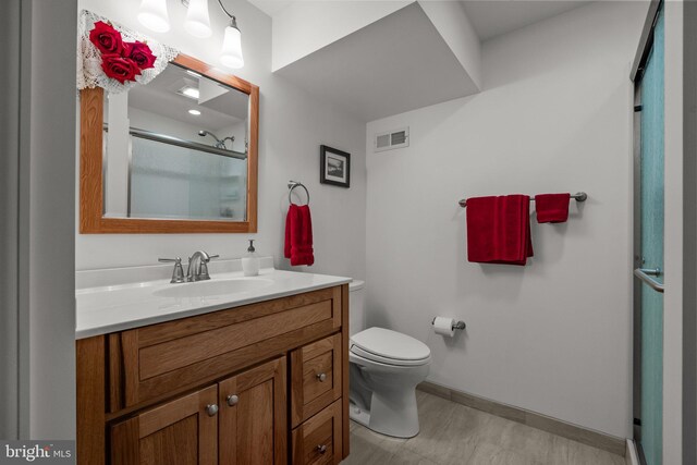 230 Bobwhite Rd, New Hope, PA 18938 - bathroom featuring vanity, toilet, a shower with door, and baseboards