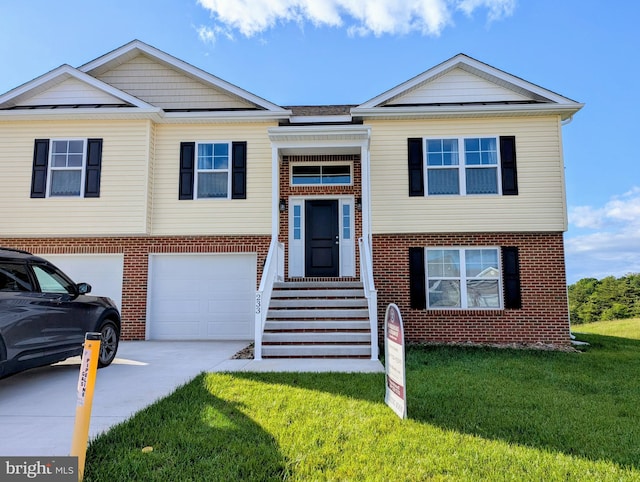 233 Finney Dr, Martinsburg, WV 25405 - view of front of property with driveway, brick siding, a garage, and a front lawn