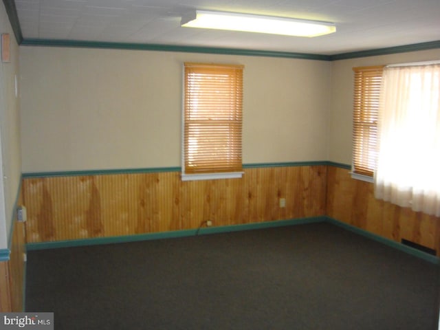 4312 Fritchey St, Lower Paxton, PA 17109 - carpeted spare room featuring plenty of natural light, ornamental molding, wooden walls, and a wainscoted wall