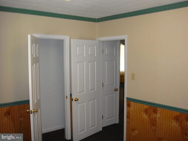 4312 Fritchey St, Lower Paxton, PA 17109 - unfurnished bedroom featuring a wainscoted wall, wood walls, and crown molding