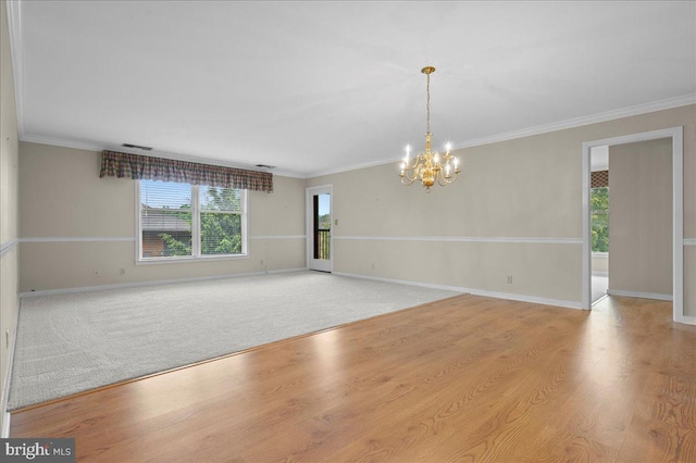 3203 Falcon Ln Ste 311, Wilmington, DE 19808 - empty room with a chandelier, ornamental molding, baseboards, and light wood finished floors