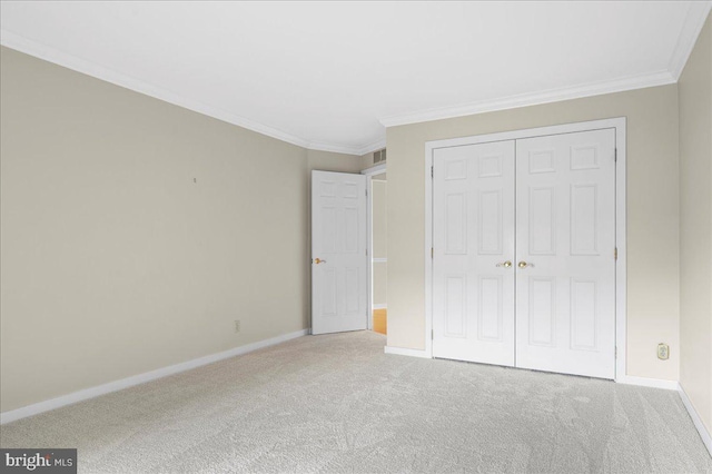 3203 Falcon Ln Ste 311, Wilmington, DE 19808 - unfurnished bedroom featuring carpet flooring, baseboards, ornamental molding, and a closet