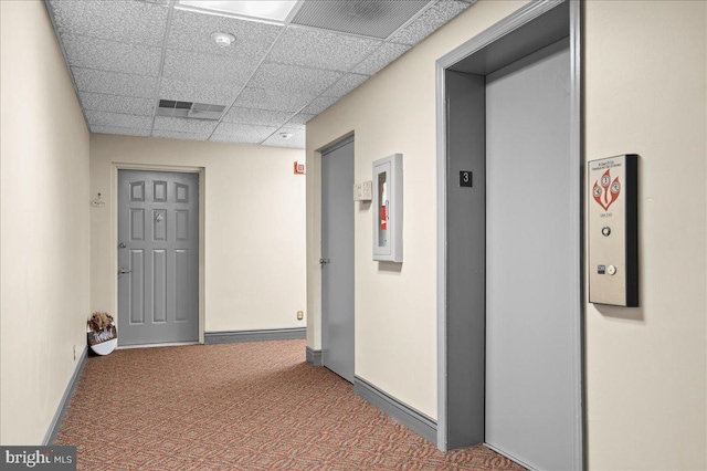 3203 Falcon Ln Ste 311, Wilmington, DE 19808 - corridor with elevator, a paneled ceiling, carpet flooring, and baseboards