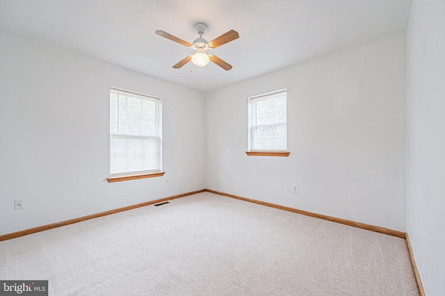 1627 Kindle Ave, Deptford, NJ 08096 - unfurnished room with healthy amount of natural light, carpet flooring, ceiling fan, and baseboards