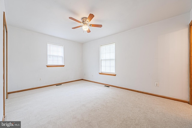 1627 Kindle Ave, Deptford, NJ 08096 - empty room with plenty of natural light, light carpet, ceiling fan, and baseboards
