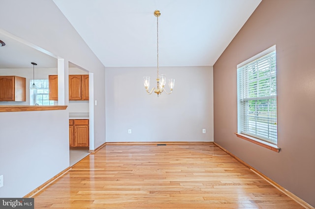 1627 Kindle Ave, Deptford, NJ 08096 - unfurnished dining area featuring light wood-style flooring, a chandelier, lofted ceiling, and baseboards
