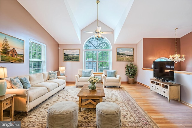 1627 Kindle Ave, Deptford, NJ 08096 - living room featuring light wood-type flooring, a chandelier, a ceiling fan, baseboards, and lofted ceiling