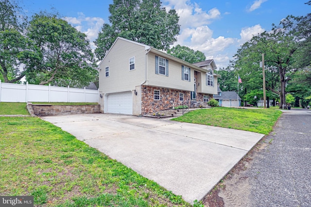 1627 Kindle Ave, Deptford, NJ 08096 - view of property exterior with a garage, stone siding, and concrete driveway