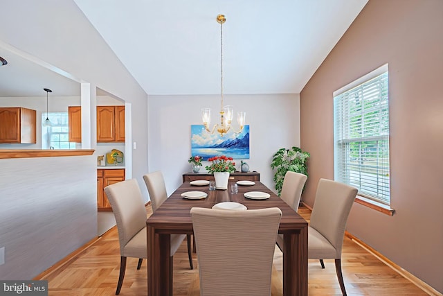 1627 Kindle Ave, Deptford, NJ 08096 - dining room featuring a chandelier, healthy amount of natural light, vaulted ceiling, and baseboards