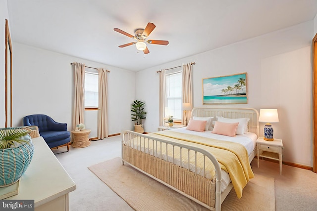 1627 Kindle Ave, Deptford, NJ 08096 - bedroom featuring light colored carpet, multiple windows, ceiling fan, and baseboards