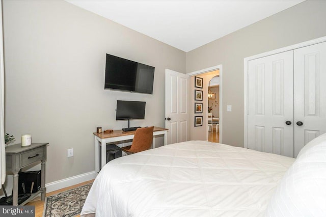 2500 Waterside Dr Unit 110, Frederick, MD 21701 - bedroom with wood finished floors, baseboards, a closet, and an office area