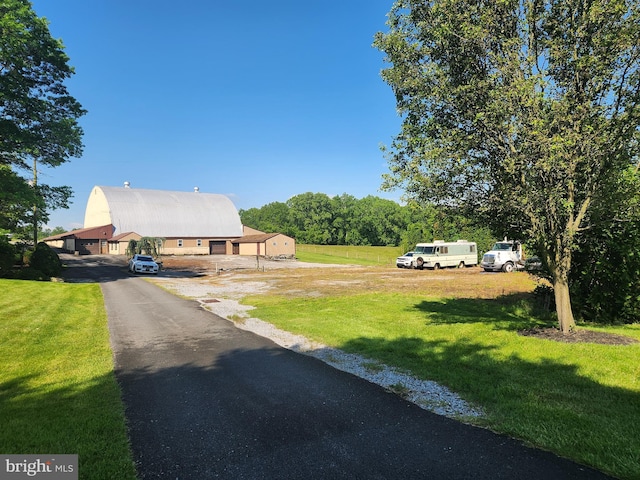 4560 Bossler Rd, Elizabethtown, PA 17022 - view of front of home with a front yard, metal roof, and an outbuilding