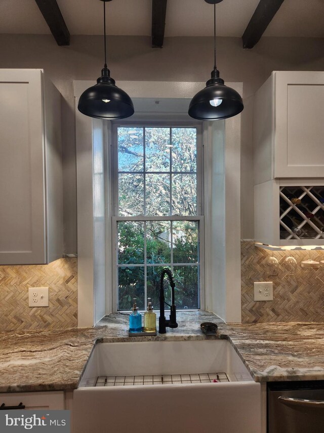 4560 Bossler Rd, Elizabethtown, PA 17022 - kitchen with a sink, backsplash, stainless steel dishwasher, beamed ceiling, and white cabinetry