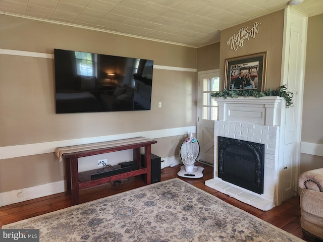 4560 Bossler Rd, Elizabethtown, PA 17022 - living area with wood finished floors, a fireplace, and ornamental molding