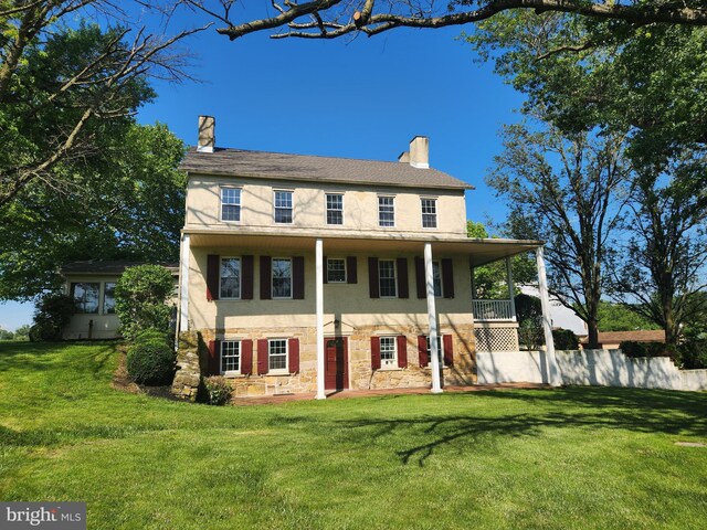 4560 Bossler Rd, Elizabethtown, PA 17022 - view of front of property featuring stone siding, a chimney, stucco siding, and a balcony