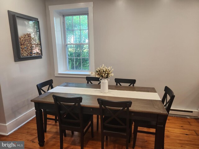 4560 Bossler Rd, Elizabethtown, PA 17022 - dining area featuring baseboard heating, wood finished floors, and baseboards