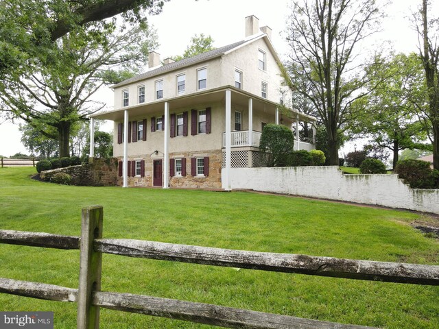 4560 Bossler Rd, Elizabethtown, PA 17022 - view of front of house with a chimney, stone siding, and stucco siding
