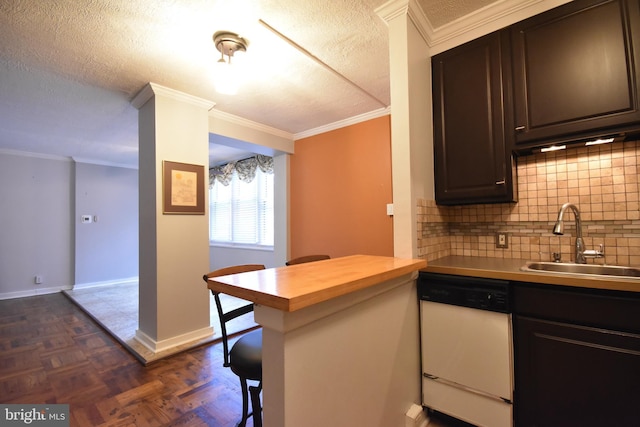 80 W Baltimore Ave, Lansdowne, PA 19050 - kitchen featuring white dishwasher, a sink, tasteful backsplash, a kitchen bar, and baseboards