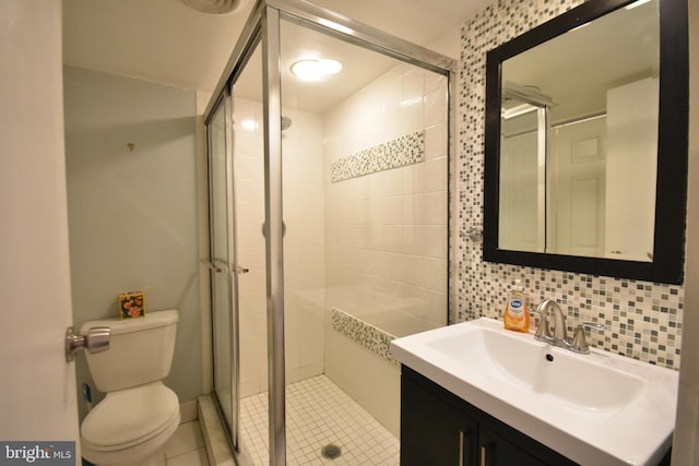 80 W Baltimore Ave, Lansdowne, PA 19050 - bathroom featuring toilet, a stall shower, vanity, tile patterned flooring, and tile walls