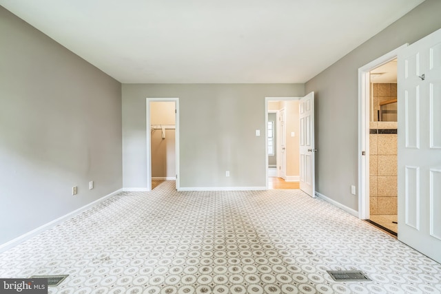 3818 Gelding Ln, Olney, MD 20832 - unfurnished bedroom featuring baseboards, a spacious closet, connected bathroom, and a closet