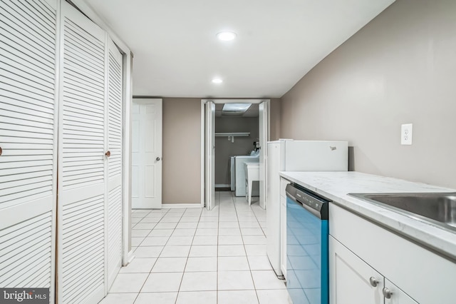 3818 Gelding Ln, Olney, MD 20832 - kitchen featuring dishwashing machine, white cabinets, light tile patterned floors, washer / clothes dryer, and recessed lighting
