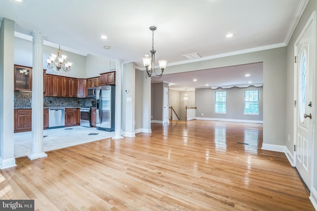 3818 Gelding Ln, Olney, MD 20832 - kitchen with appliances with stainless steel finishes, a chandelier, open floor plan, tasteful backsplash, and light wood-type flooring