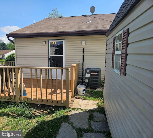 962 Wampler Ln, Westminster, MD 21158 - back of house with central AC unit, a deck, and roof with shingles