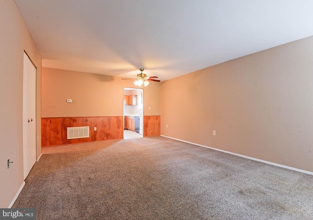 962 Wampler Ln, Westminster, MD 21158 - carpeted spare room with wainscoting, a ceiling fan, and wood walls