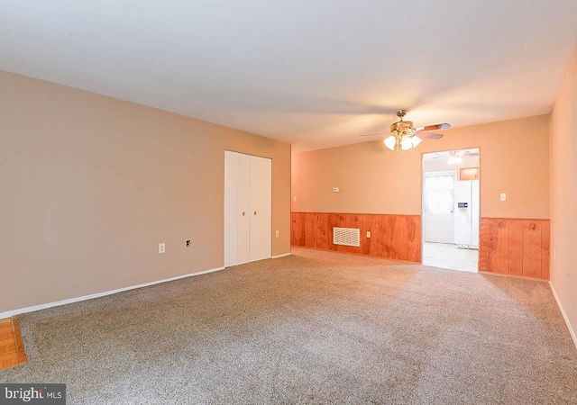 962 Wampler Ln, Westminster, MD 21158 - empty room featuring a wainscoted wall, ceiling fan, wood walls, and carpet flooring