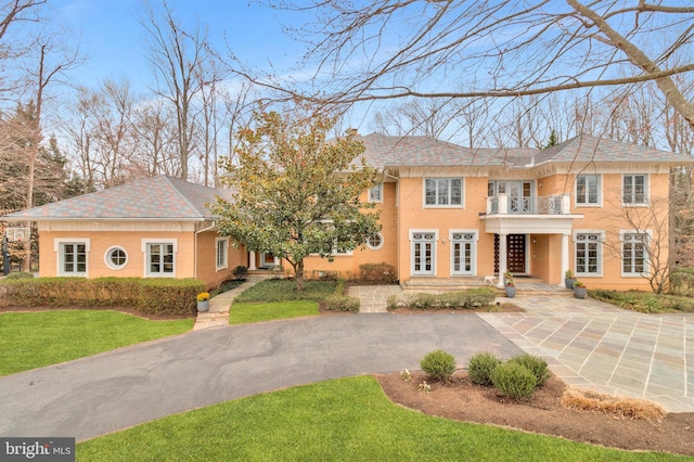 918 Centrillion Dr, Mclean, VA 22102 - colonial home featuring french doors, a front lawn, a balcony, and driveway