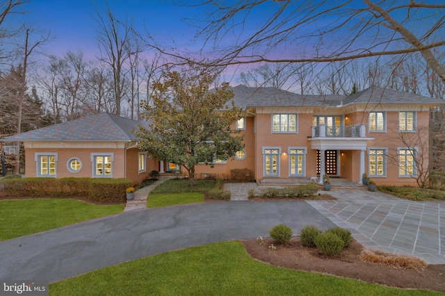 918 Centrillion Dr, Mclean, VA 22102 - colonial inspired home with french doors, a yard, a balcony, driveway, and roof with shingles