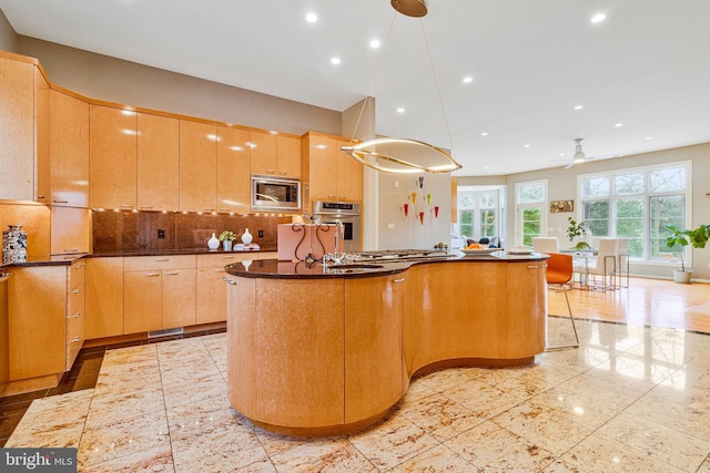918 Centrillion Dr, Mclean, VA 22102 - kitchen featuring stainless steel appliances, a center island, recessed lighting, dark countertops, and ceiling fan