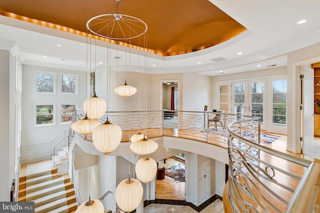 918 Centrillion Dr, Mclean, VA 22102 - stairs featuring recessed lighting, healthy amount of natural light, french doors, ornamental molding, and a tray ceiling