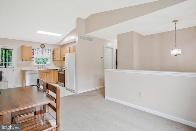 6040 Shady Side Rd, Shady Side, MD 20764 - kitchen with dishwasher, white fridge with ice dispenser, stainless steel electric range, vaulted ceiling, and light countertops