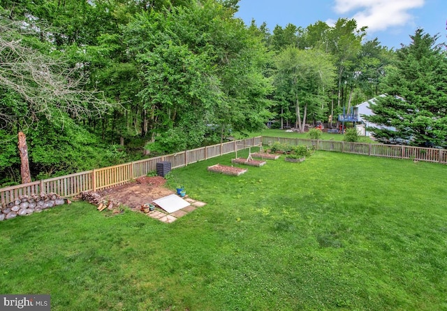 6040 Shady Side Rd, Shady Side, MD 20764 - fenced backyard featuring a vegetable garden