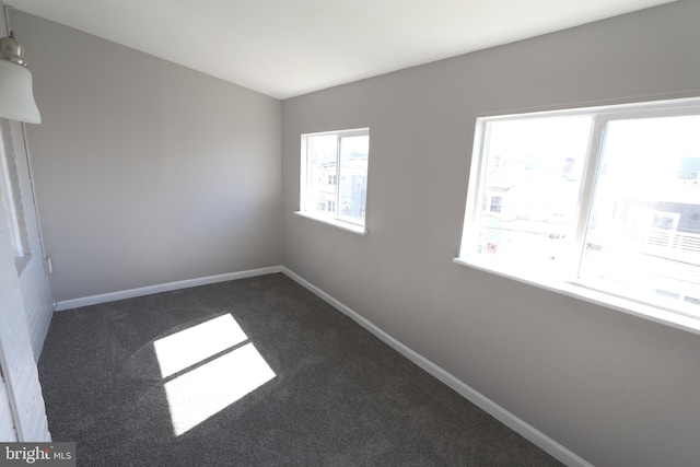1235 Owen Pl NE, Washington, DC 20002 - unfurnished room featuring dark carpet and baseboards