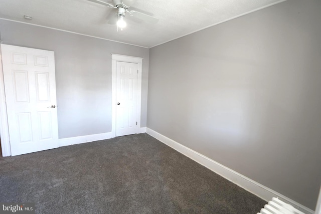 1235 Owen Pl NE, Washington, DC 20002 - unfurnished bedroom with dark colored carpet and radiator heating unit