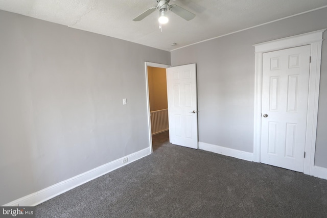 1235 Owen Pl NE, Washington, DC 20002 - unfurnished bedroom with dark carpet and a ceiling fan