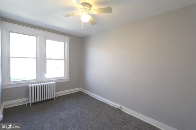1235 Owen Pl NE, Washington, DC 20002 - unfurnished room featuring radiator, dark carpet, and a ceiling fan