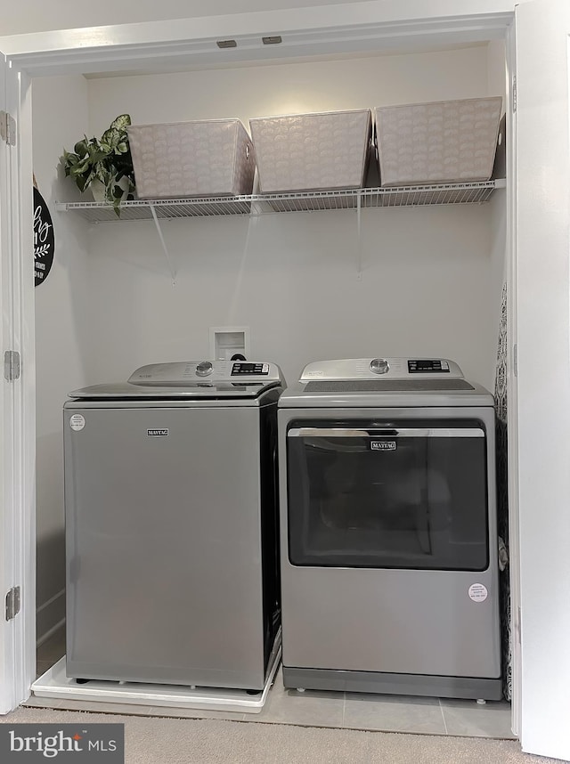45375 Concord Way, California, MD 20619 - laundry room featuring washer and clothes dryer and light tile patterned floors