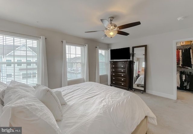 45375 Concord Way, California, MD 20619 - carpeted bedroom featuring a walk in closet, a closet, baseboards, and ceiling fan