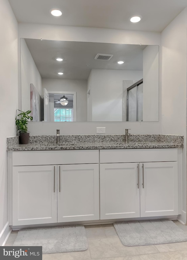 45375 Concord Way, California, MD 20619 - bathroom featuring double vanity, recessed lighting, and a shower with shower door