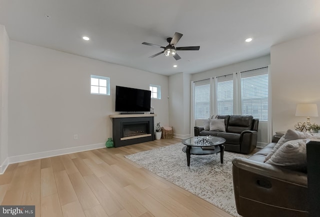 45375 Concord Way, California, MD 20619 - living room featuring a glass covered fireplace, a ceiling fan, wood finished floors, baseboards, and recessed lighting