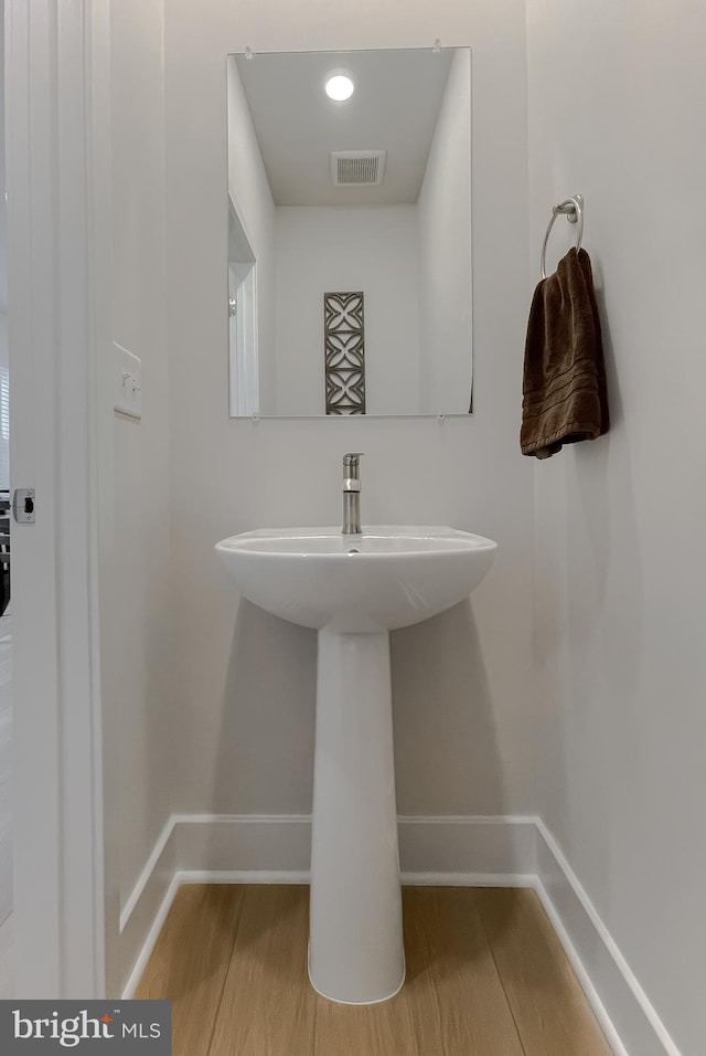 45375 Concord Way, California, MD 20619 - bathroom featuring wood finished floors, baseboards, and a sink