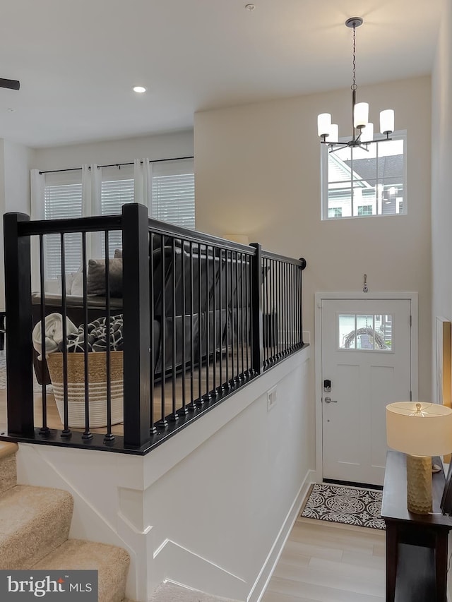 45375 Concord Way, California, MD 20619 - stairs featuring a chandelier, baseboards, wood finished floors, and recessed lighting