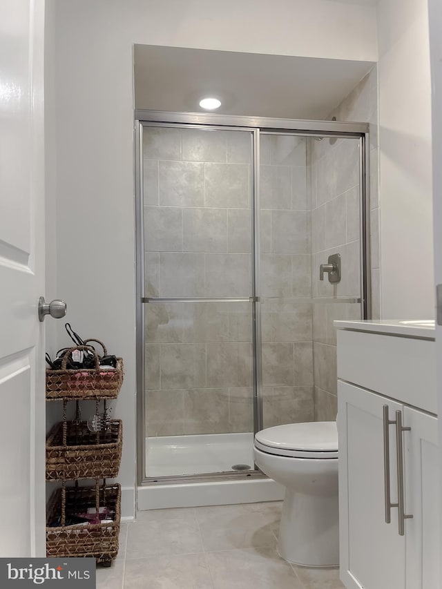 45375 Concord Way, California, MD 20619 - bathroom featuring toilet, a shower stall, vanity, and tile patterned flooring